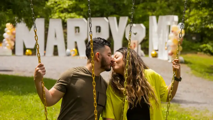 couple kiss after proposal with big light up letters | www.mybigletters.com | ©effortless elopements