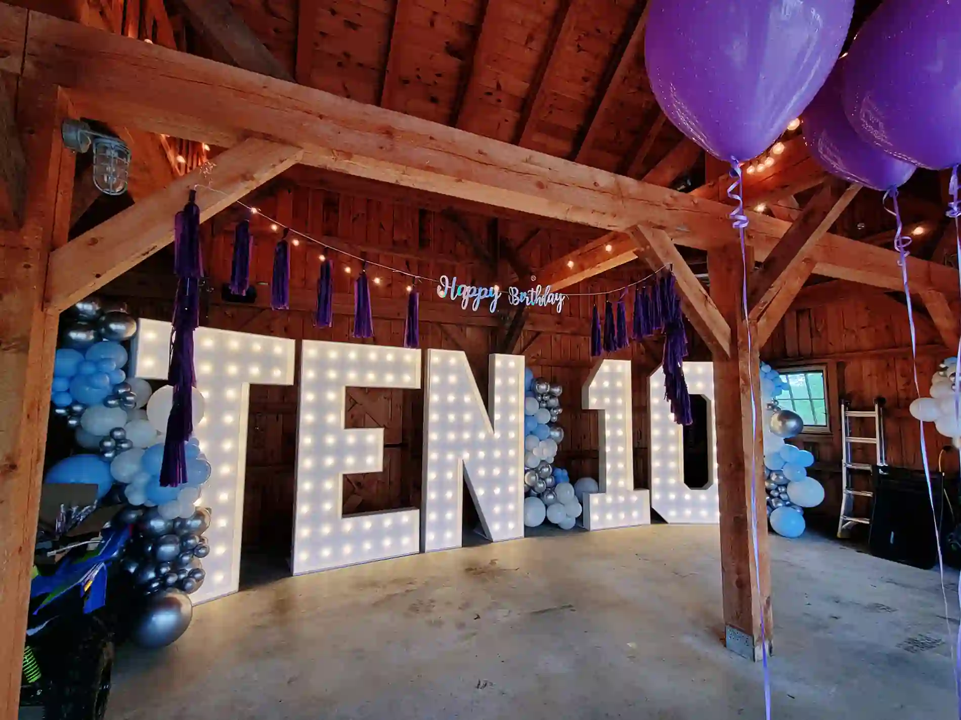 10th birthday party in Franklin, TN with Birthday Marquee Numbers For Rent spelling TEN10 with blue, white, and silver balloons