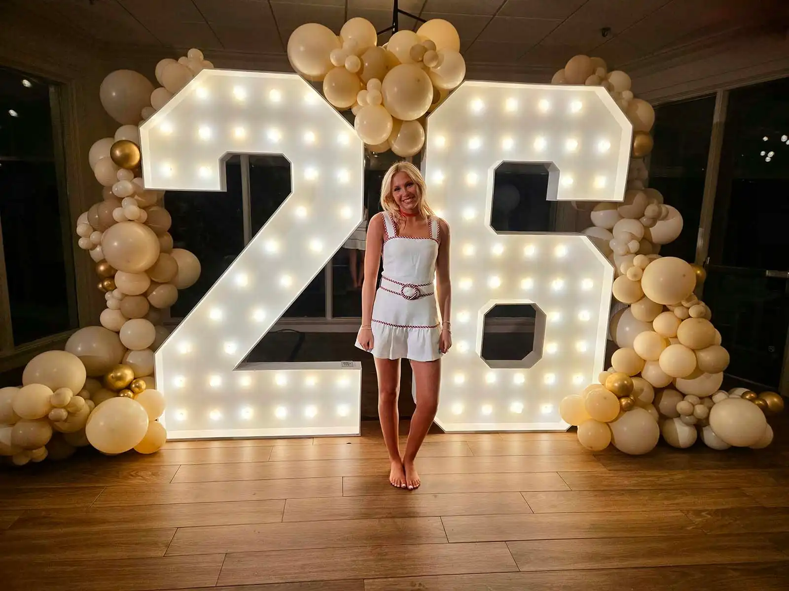 26 graduation marquee numbers with graduate and balloons in Brentwood