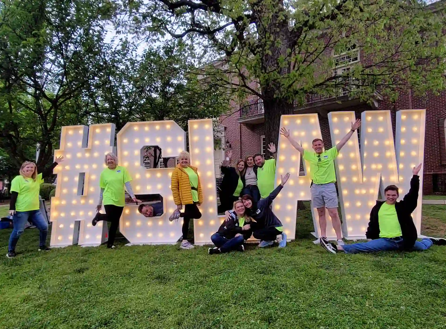 LAW 7-foot marquee letters surrounded by guests at a Nashville corporate event