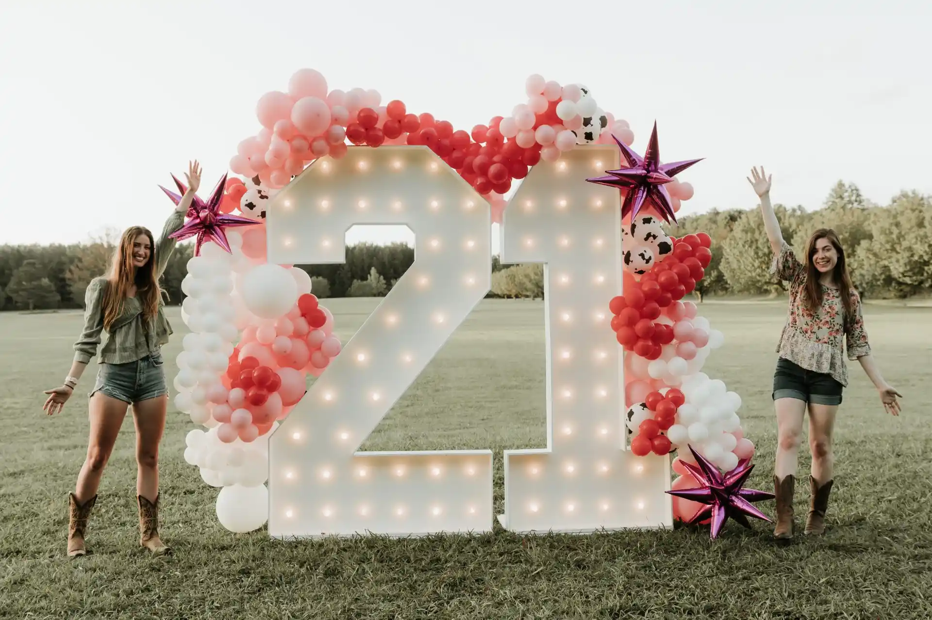 21st birthday marquee numbers with pink and white balloons at Brentwood Country Club
