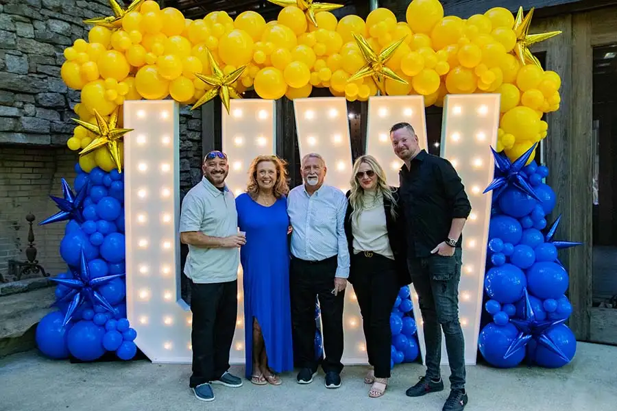 7ft UW marquee letters with blue and yellow balloons at a Franklin TN event