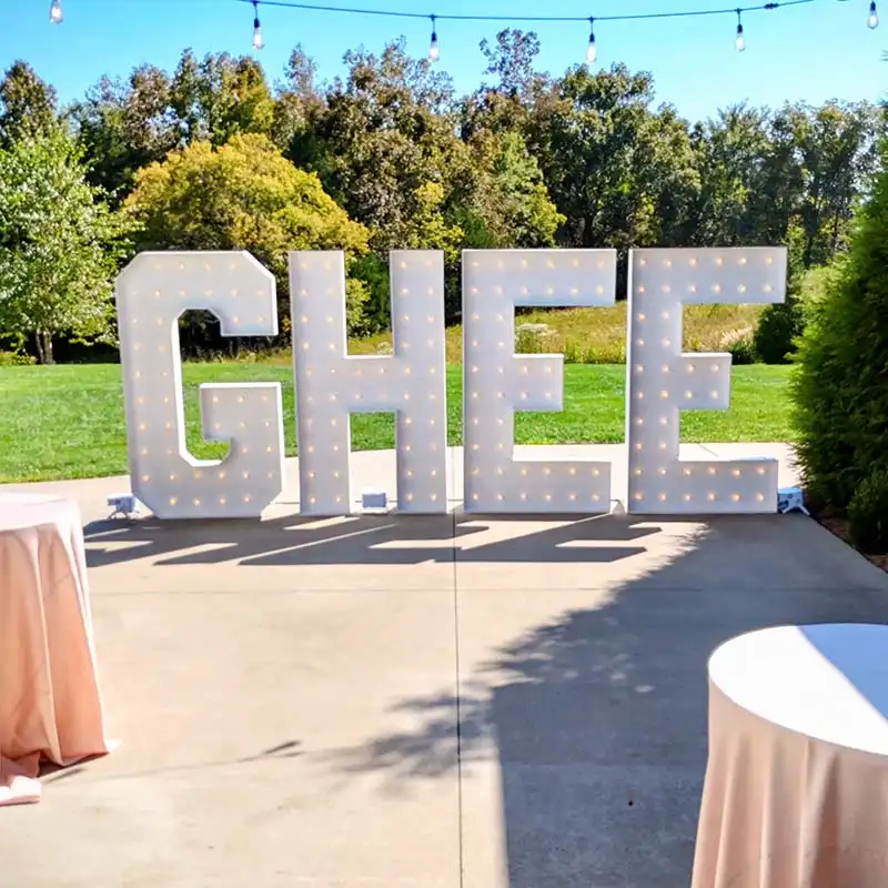 7ft GHEE last name marquee letters at a wedding reception