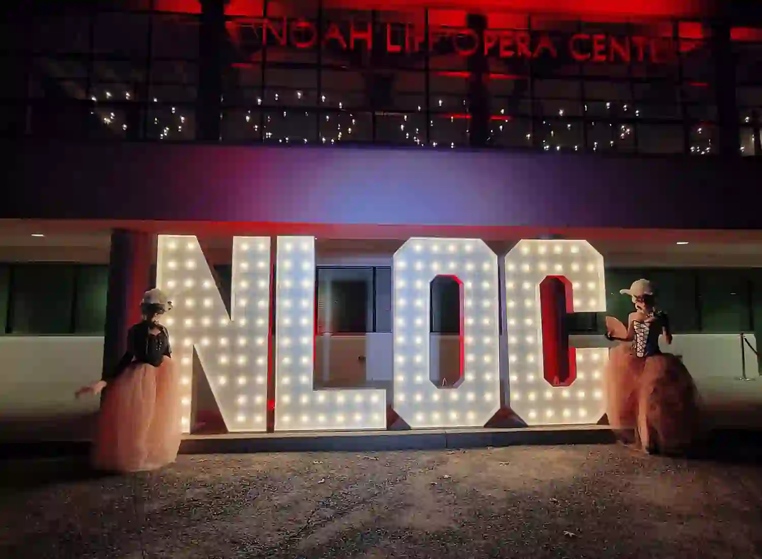 NLOC light up marquee letters at corporate event in Nashville, TN with Goodness Gracious team in masquerade attire