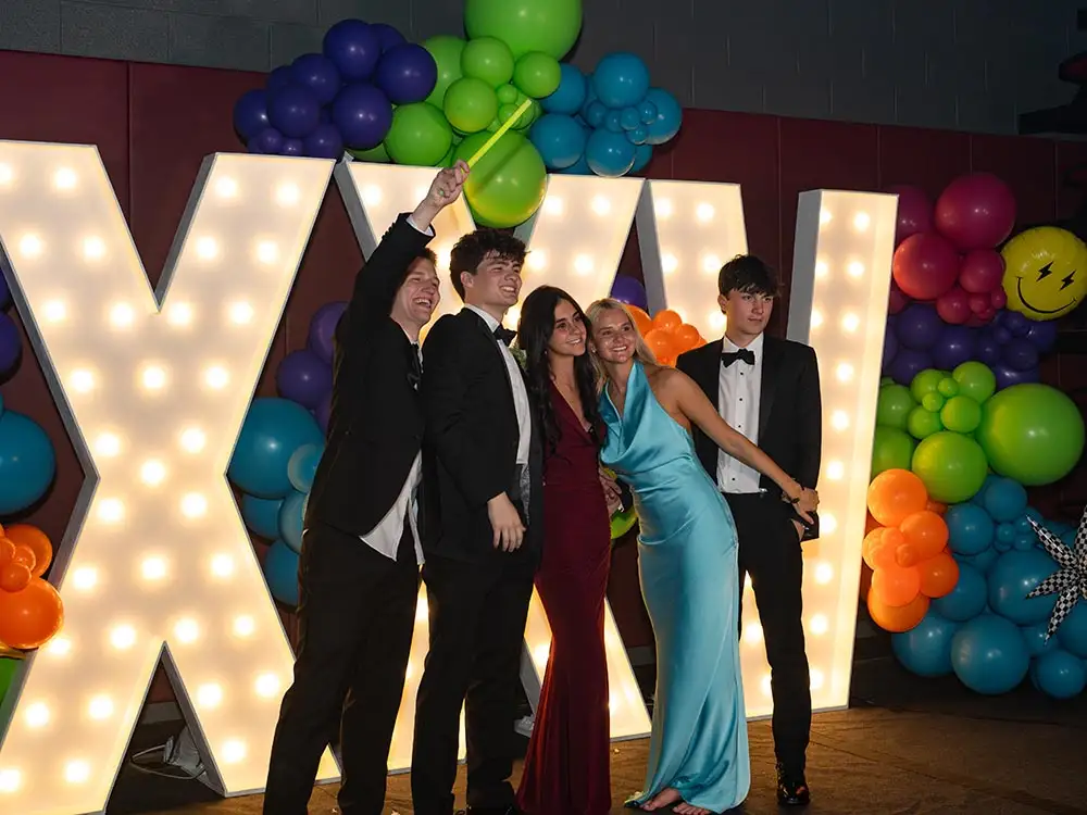 7ft marquee letter rental at prom in Nashville with students posing at Montgomery Bell Academy