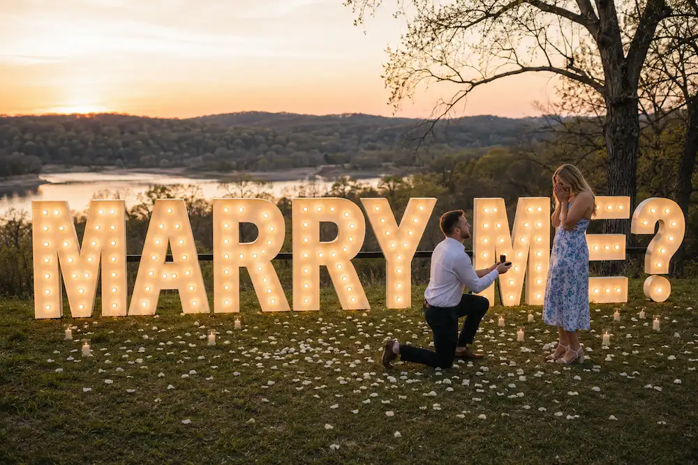 Marriage proposal in Middle Tennessee with glowing MARRY ME marquee letters at sunset