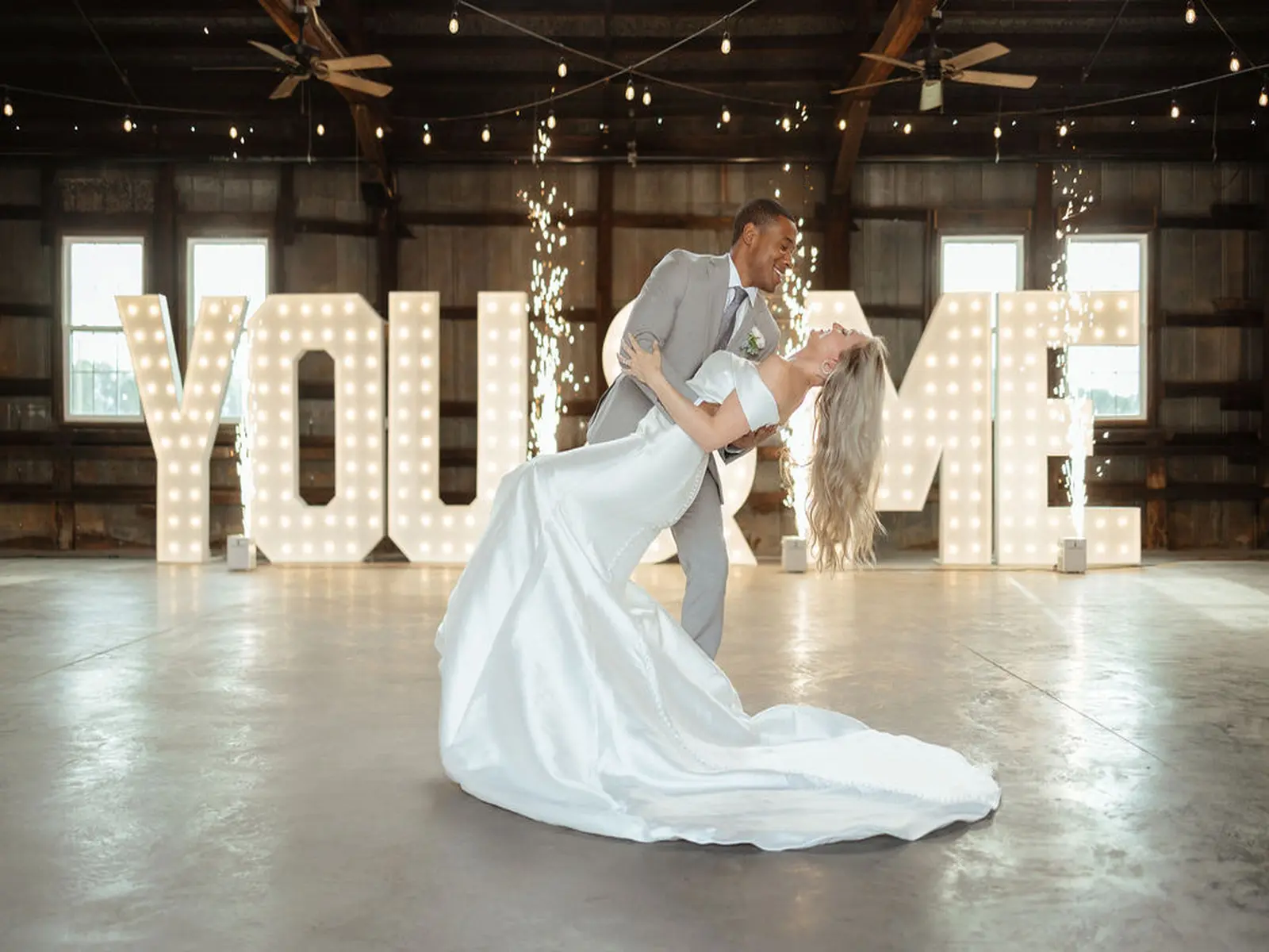Bride and Groom Dip Kiss in Front of Marquee Letter Rentals for Weddings in Murfreesboro TN