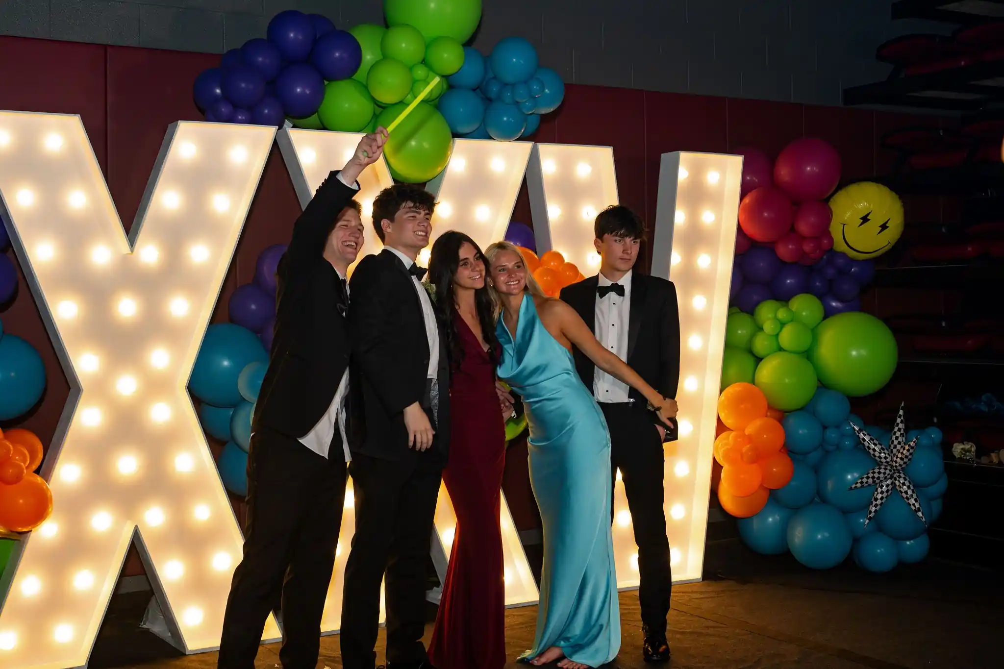 7ft XXV marquee letters Franklin at high school prom with colorful balloons